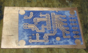 Copper clad board with toner masking a circuit